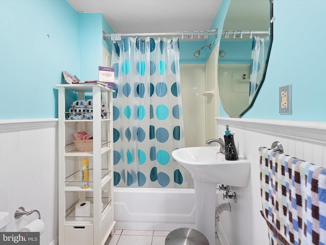 bathroom with tile patterned flooring and shower / tub combo with curtain