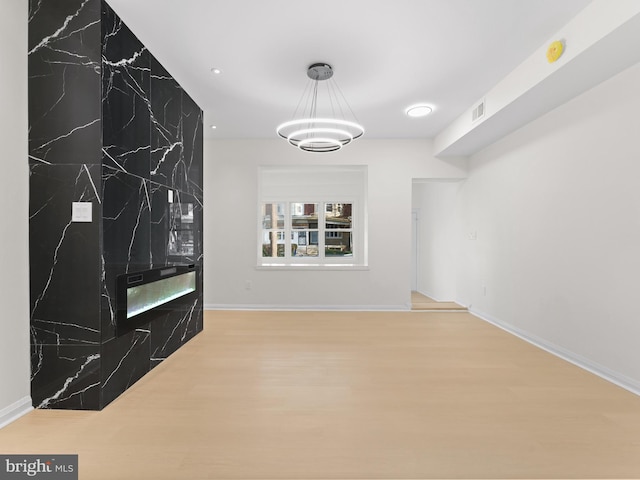 unfurnished living room featuring hardwood / wood-style floors