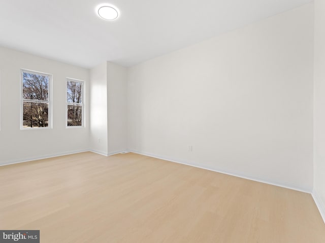 empty room with light wood-type flooring