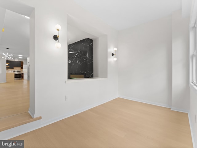 unfurnished room featuring light hardwood / wood-style floors