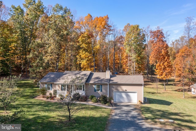 view of front facade with a front lawn and a garage