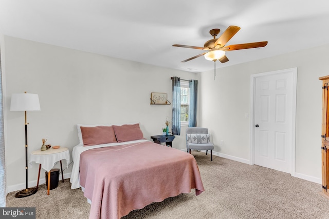 bedroom featuring light colored carpet and ceiling fan