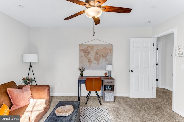 carpeted office space with ceiling fan