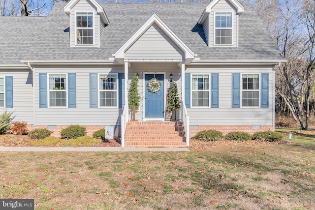 new england style home with a front lawn