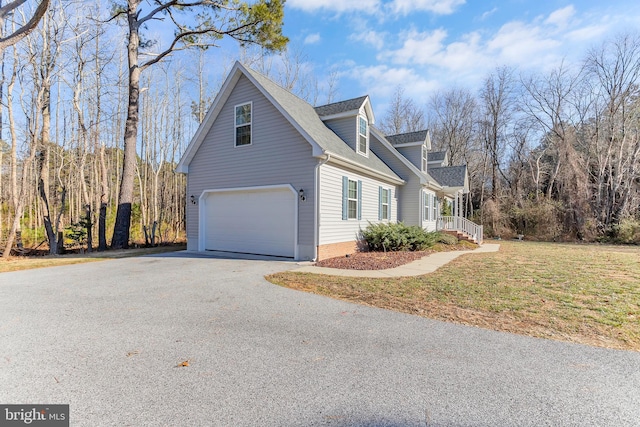 view of property exterior with a garage and a lawn