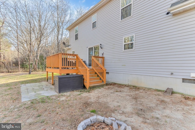 exterior space with a deck and a patio area