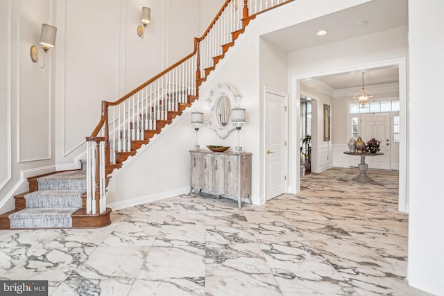 foyer featuring crown molding