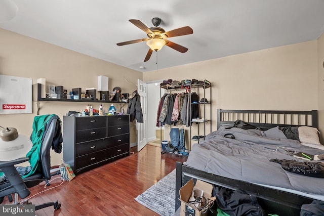 bedroom featuring dark hardwood / wood-style flooring and ceiling fan