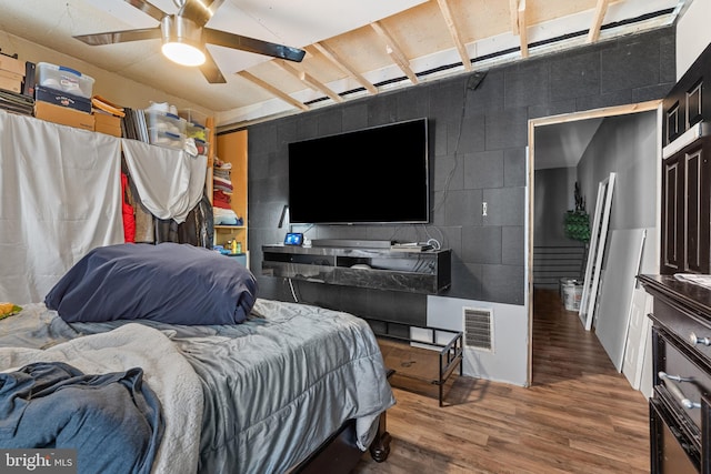 bedroom featuring hardwood / wood-style flooring and ceiling fan