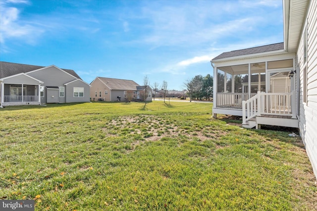 view of yard with a sunroom