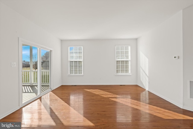 spare room featuring hardwood / wood-style flooring