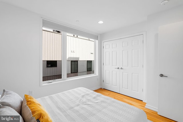 bedroom with a closet and light wood-type flooring