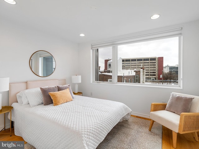 bedroom with hardwood / wood-style flooring