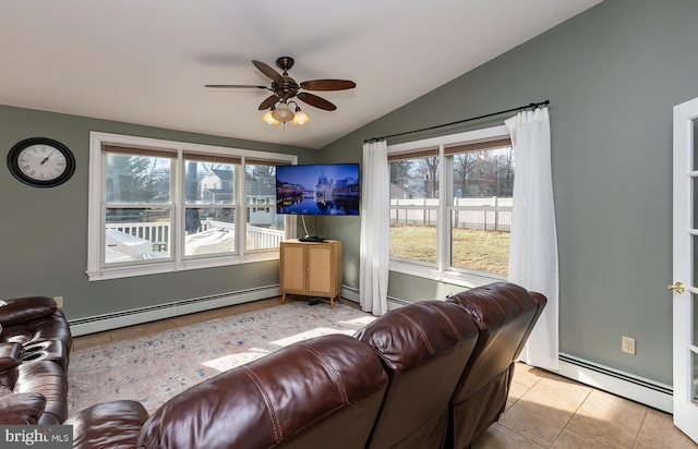 living room with vaulted ceiling, ceiling fan, a baseboard heating unit, and light tile patterned flooring