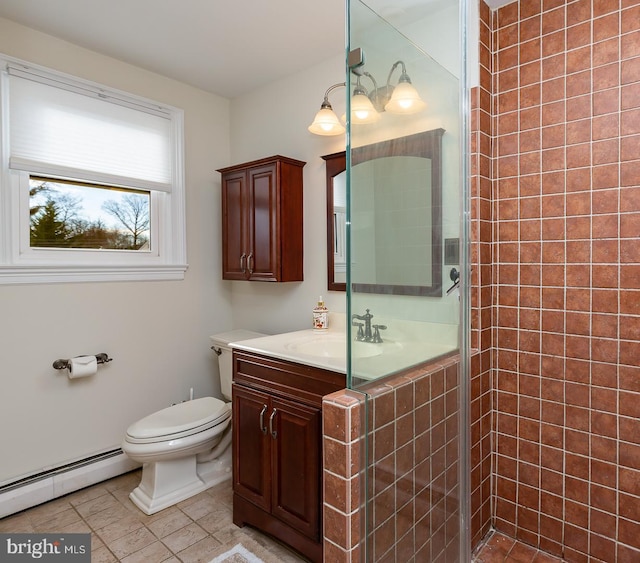 bathroom with vanity, a baseboard radiator, toilet, and a shower with shower door