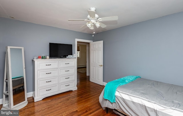 bedroom featuring ceiling fan, dark hardwood / wood-style floors, and a baseboard radiator