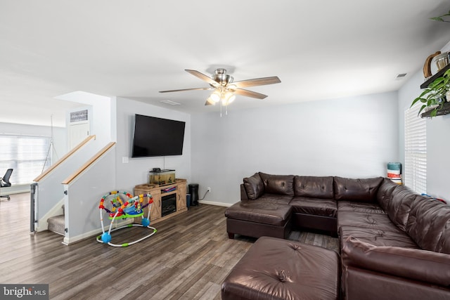 living room featuring ceiling fan, plenty of natural light, and hardwood / wood-style flooring