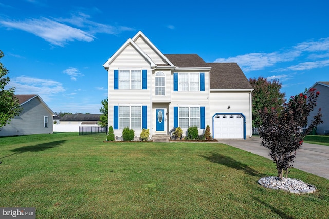 view of front of house with a front yard and a garage