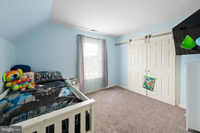 bedroom with carpet and vaulted ceiling