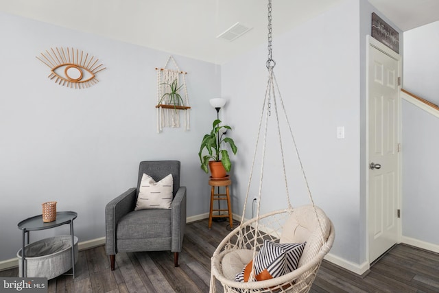 sitting room with dark hardwood / wood-style floors