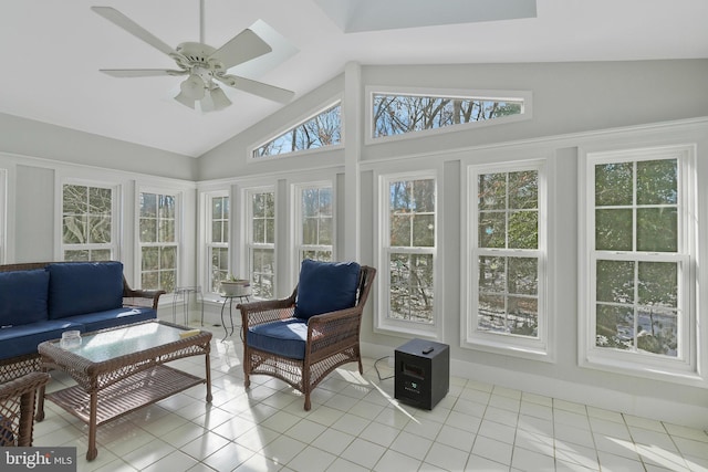 sunroom featuring ceiling fan and vaulted ceiling