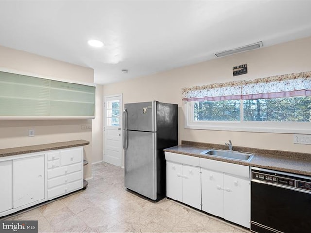 kitchen with white cabinetry, stainless steel fridge, dishwasher, and sink