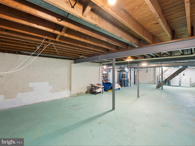 basement featuring washer and clothes dryer