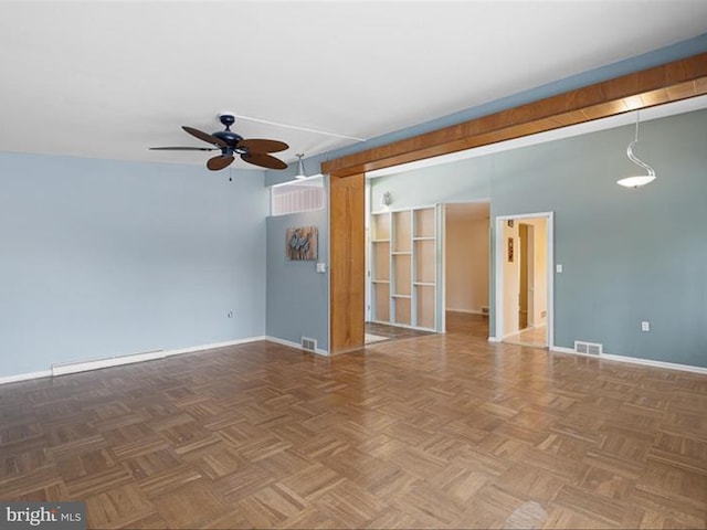 spare room featuring ceiling fan and parquet flooring