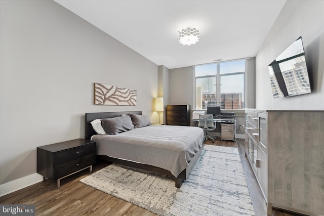 bedroom with hardwood / wood-style flooring