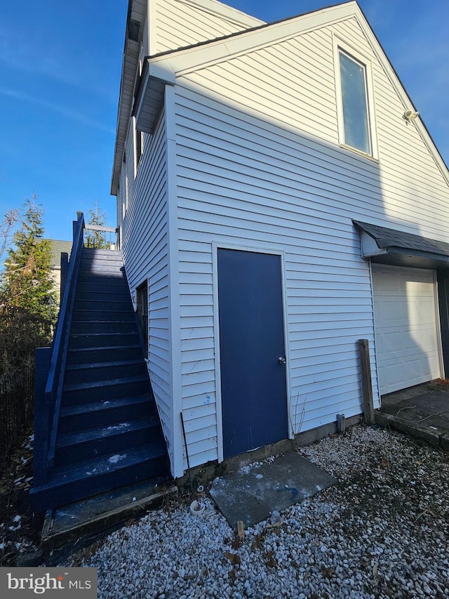 view of side of property with a garage