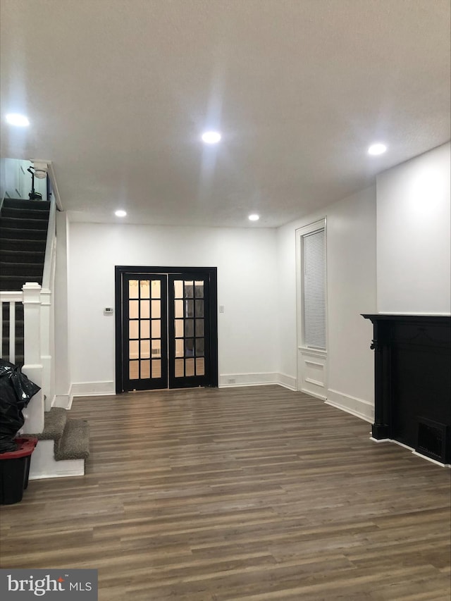 basement with dark hardwood / wood-style floors