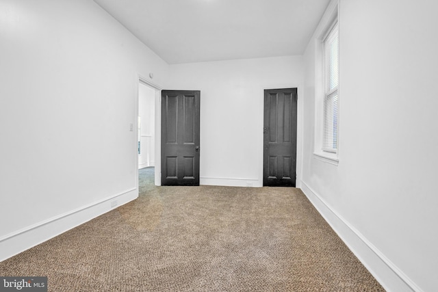 spare room featuring carpet