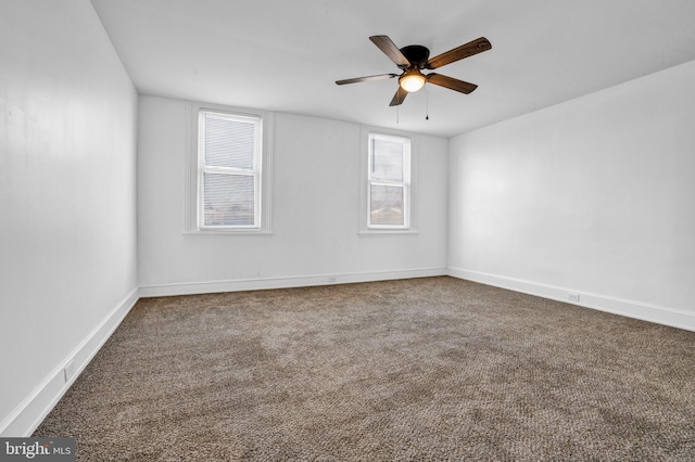 empty room featuring carpet flooring and ceiling fan