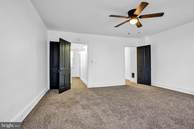 unfurnished bedroom with ceiling fan and carpet floors