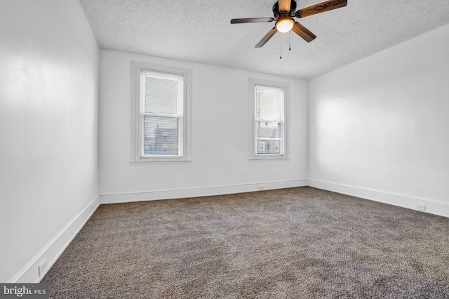 spare room with carpet flooring, a textured ceiling, and ceiling fan