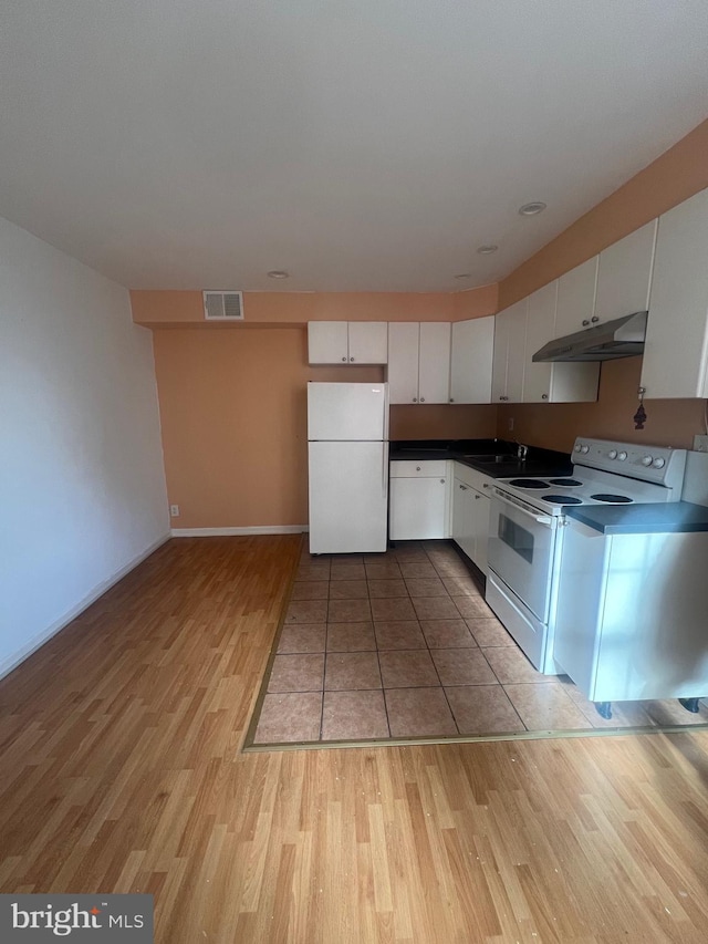 kitchen featuring white cabinetry, sink, white appliances, and light wood-type flooring