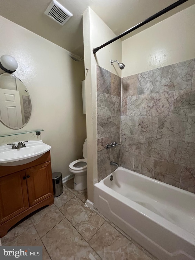 full bathroom with tiled shower / bath combo, toilet, and vanity