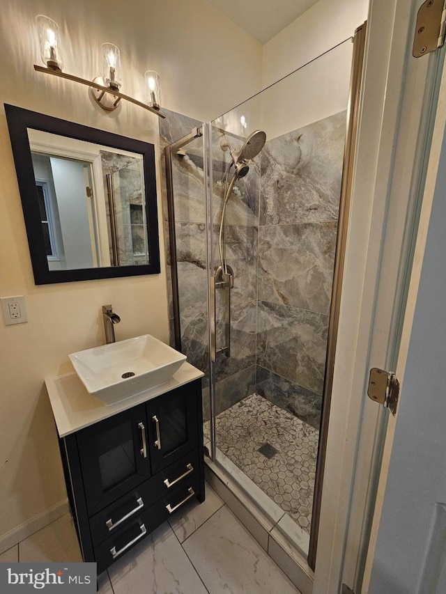 bathroom featuring vanity and tiled shower