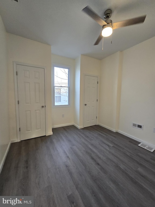 interior space featuring dark hardwood / wood-style floors and ceiling fan