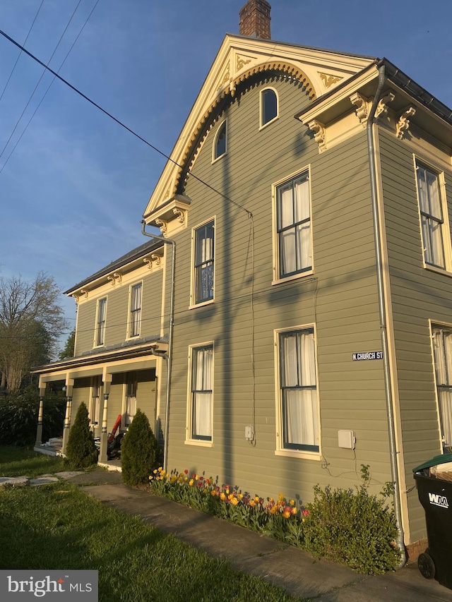 view of home's exterior featuring covered porch