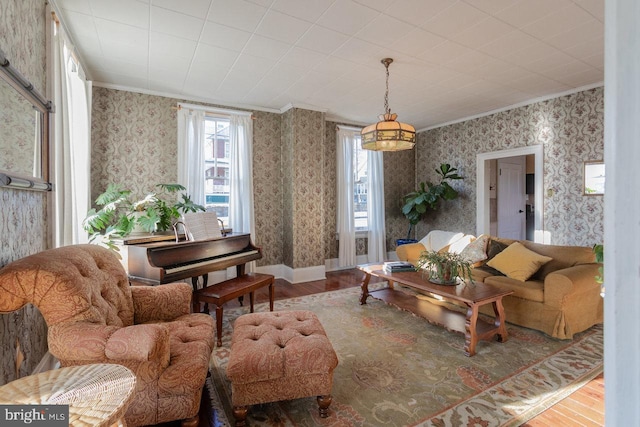 living room featuring hardwood / wood-style floors and crown molding