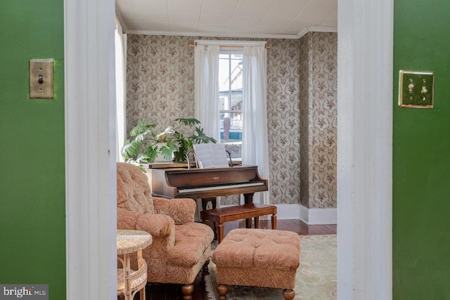 living area featuring crown molding and wood-type flooring