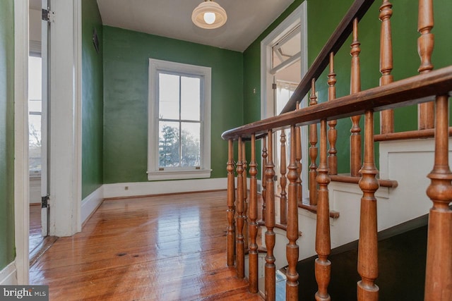 stairs with wood-type flooring