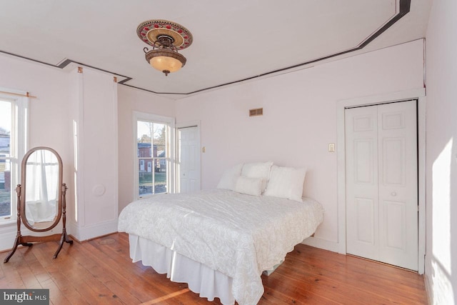 bedroom with wood-type flooring