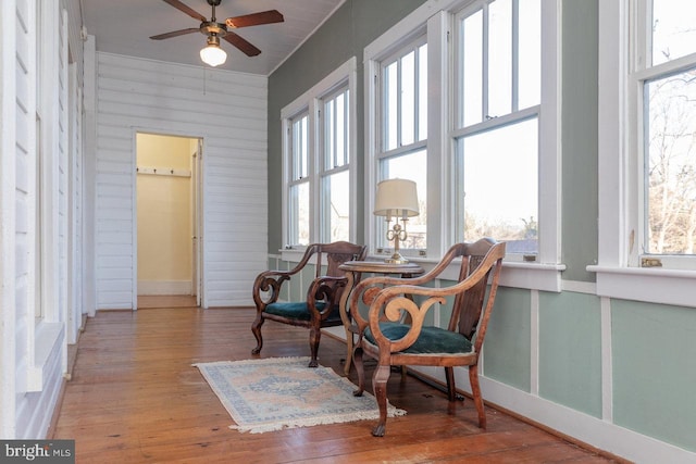 sitting room featuring ceiling fan and light hardwood / wood-style floors