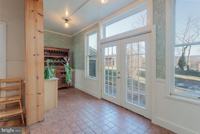 doorway to outside with french doors and ornamental molding