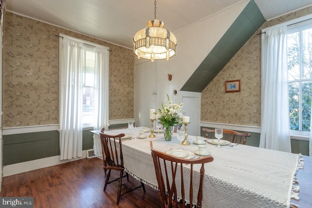 dining area with a chandelier, crown molding, a healthy amount of sunlight, and dark hardwood / wood-style floors