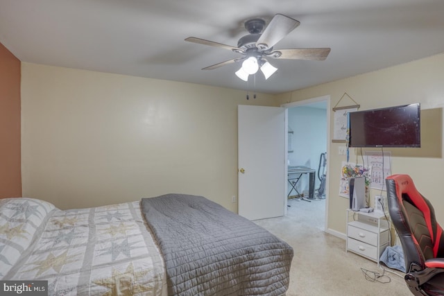 bedroom with light carpet and ceiling fan