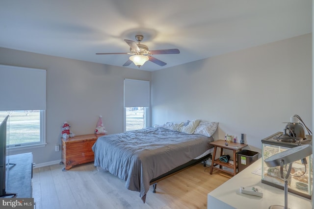 bedroom featuring wood-type flooring and ceiling fan