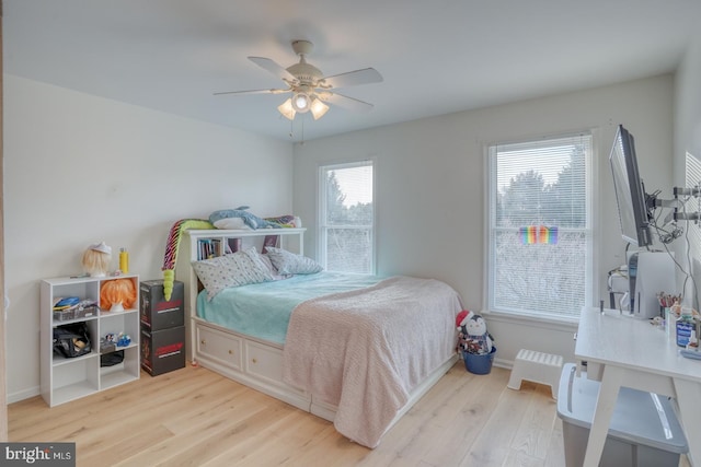 bedroom featuring ceiling fan and light hardwood / wood-style flooring